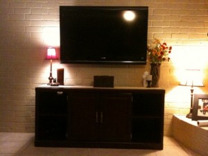 Brick wall mounted TV – The Heights Houston